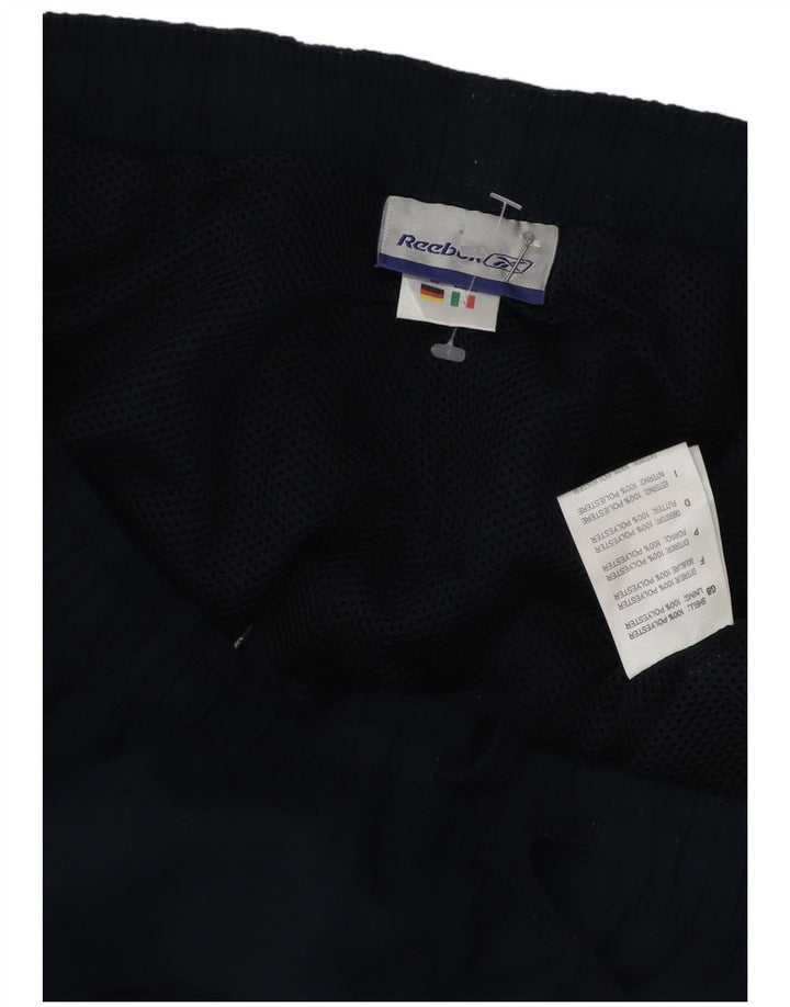 Calça de treino Reebok masculina Graphic Capri XL azul marinho poliéster