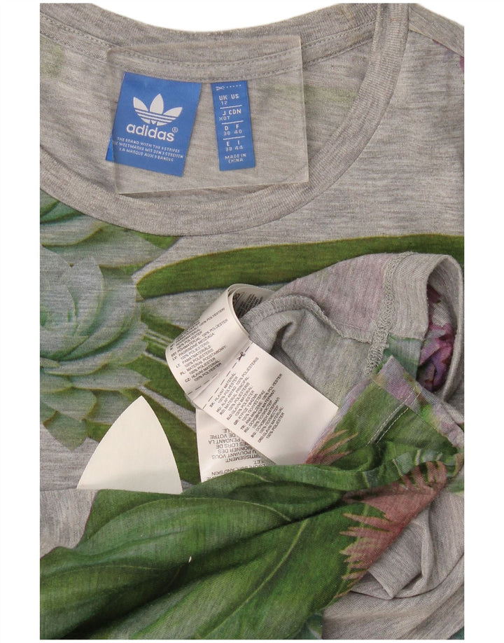 Camiseta feminina gráfica Adidas UK 12 poliéster floral cinza médio