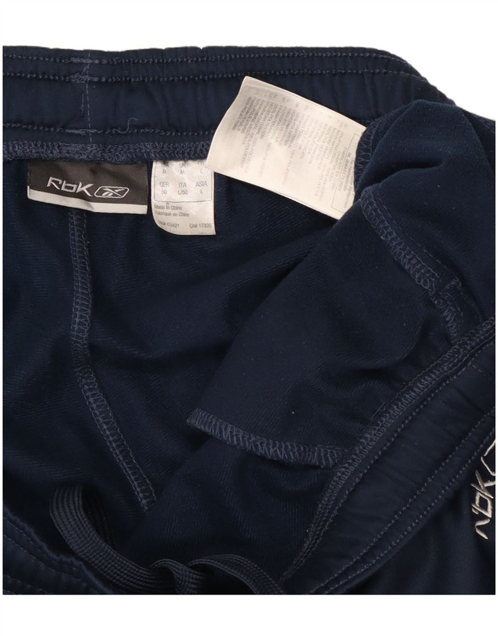 Calça de treino masculina Reebok médio azul marinho colorblock poliéster