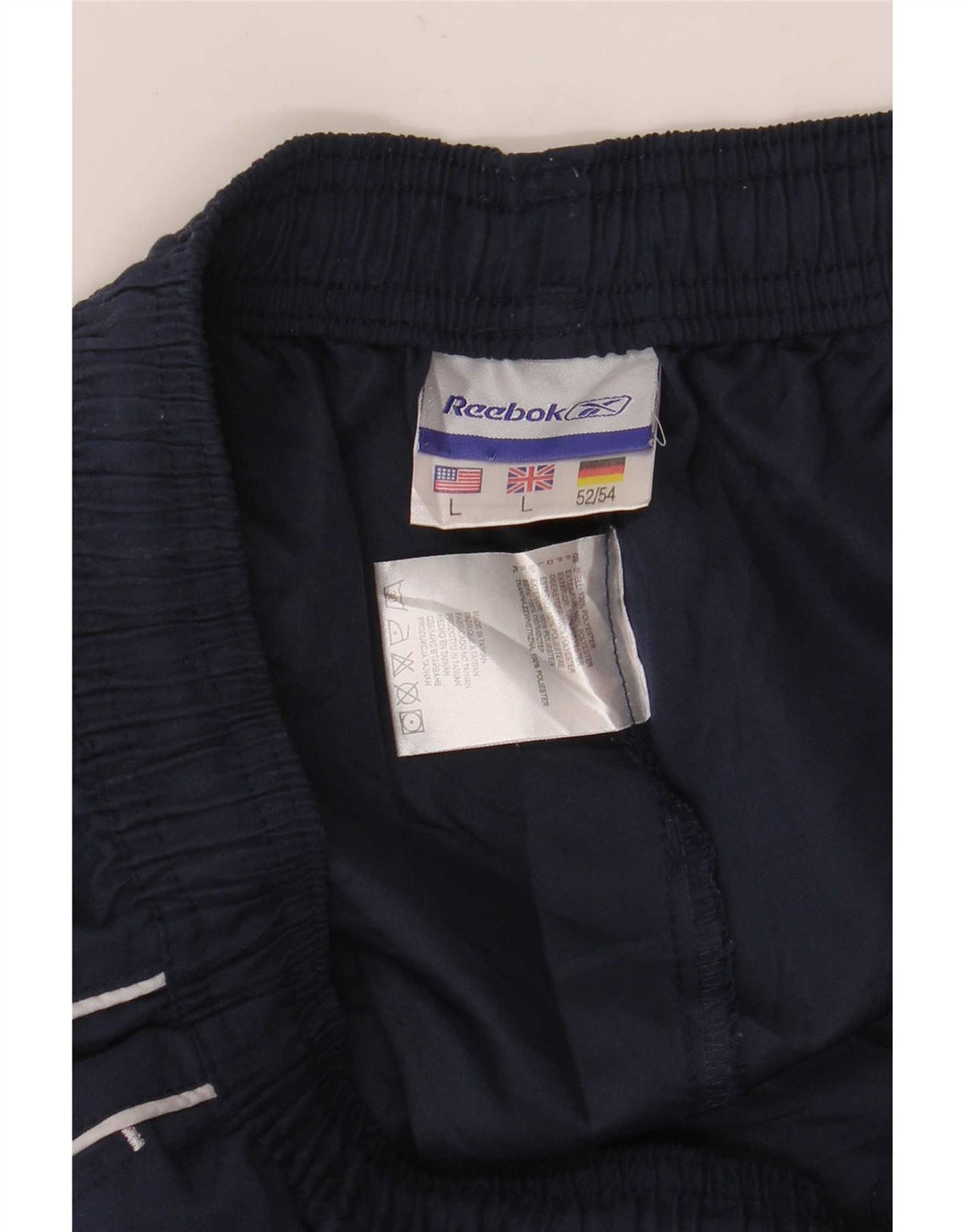 Calça de treino masculina Reebok Graphic grande poliéster azul marinho