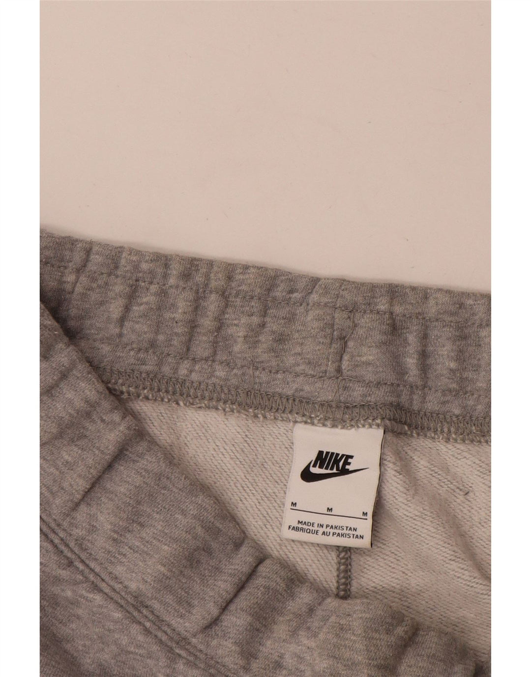 Calça de treino masculina Nike Graphic Joggers cinza médio colorblock