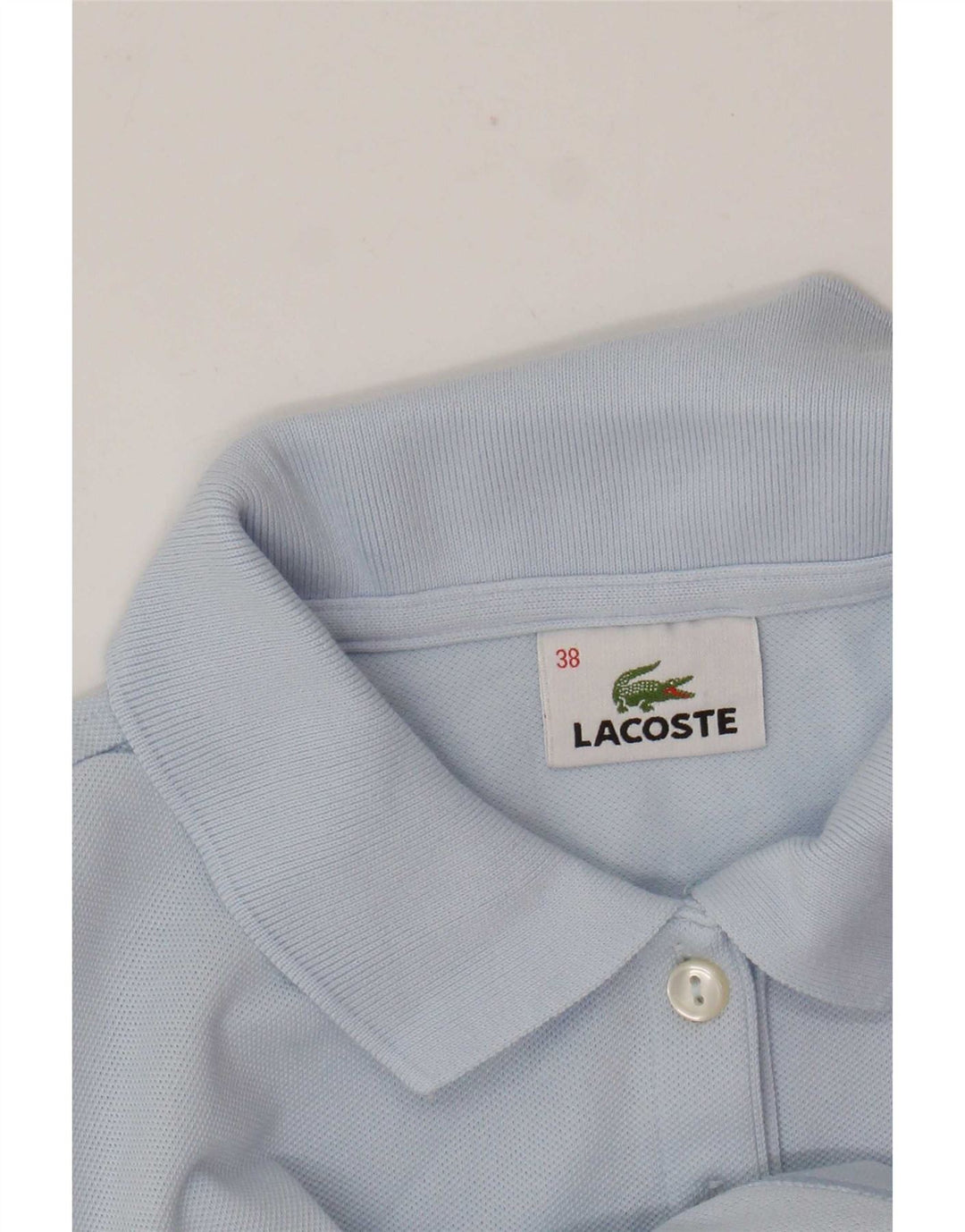 Camisa polo feminina Lacoste tamanho 38 azul médio