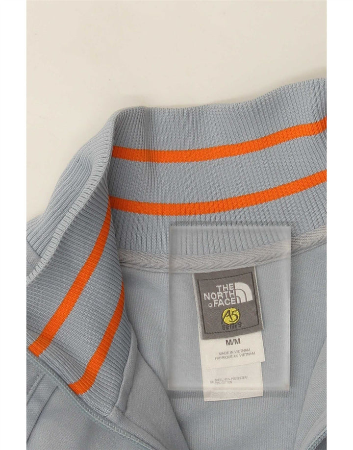 Jaqueta de treino feminina The North Face UK 12 poliéster azul médio