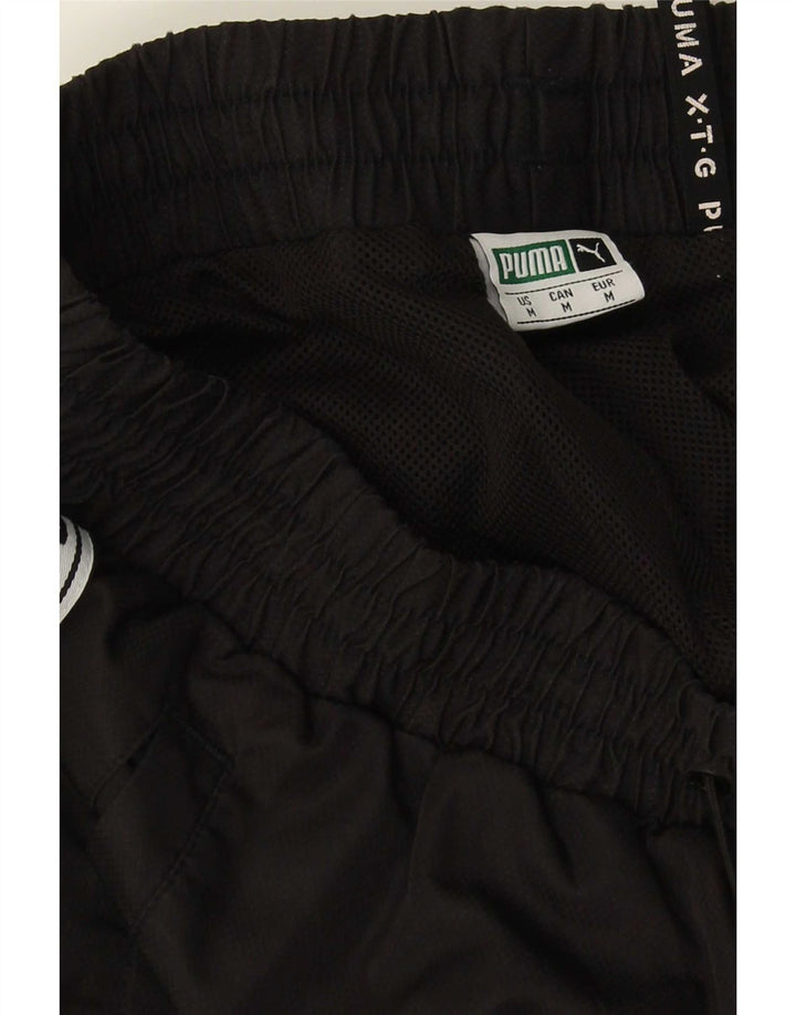 Calça esportiva masculina Puma Graphic Joggers médio preto colorblock