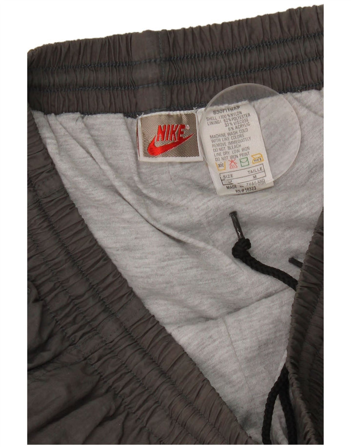Calça de treino masculina Nike Joggers cinza médio nylon