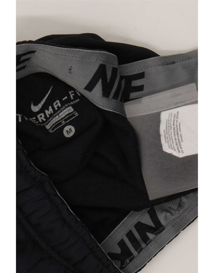 Calça de treino masculina Nike Therma-Fit de poliéster azul marinho médio