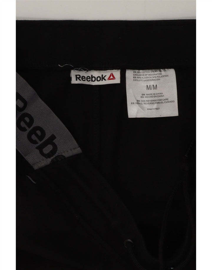 REEBOK Calça de treino masculina gráfica Joggers médio preto colorblock