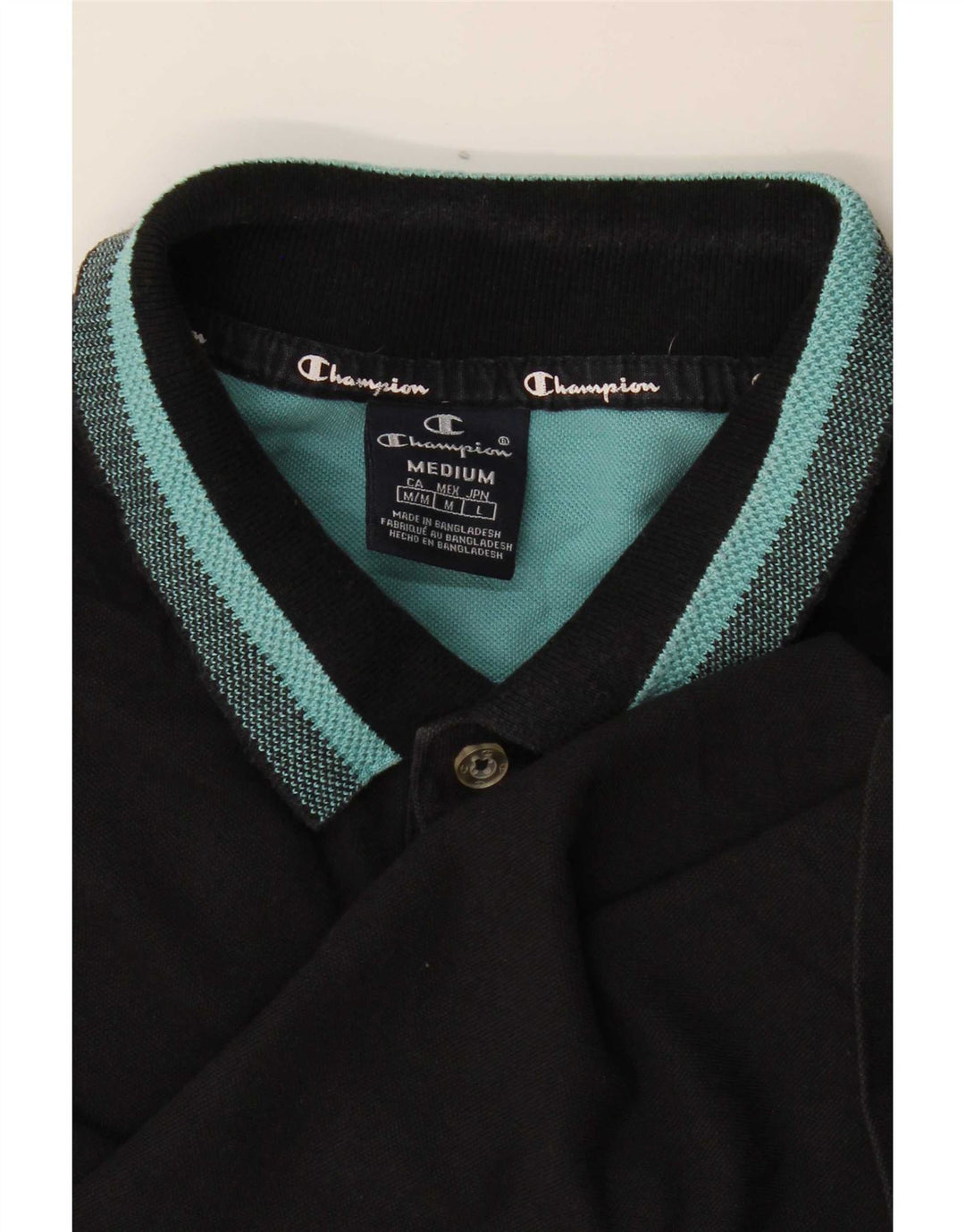 Camisa polo masculina Champion média preta listrada