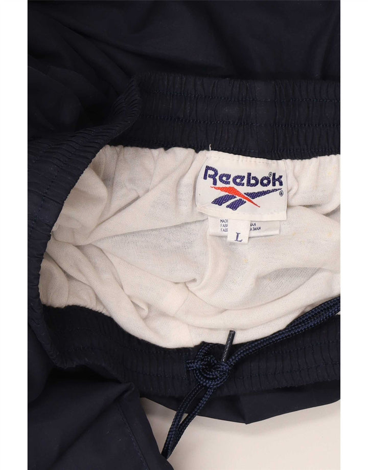 Calça de treino masculina Reebok Joggers grande poliéster azul marinho