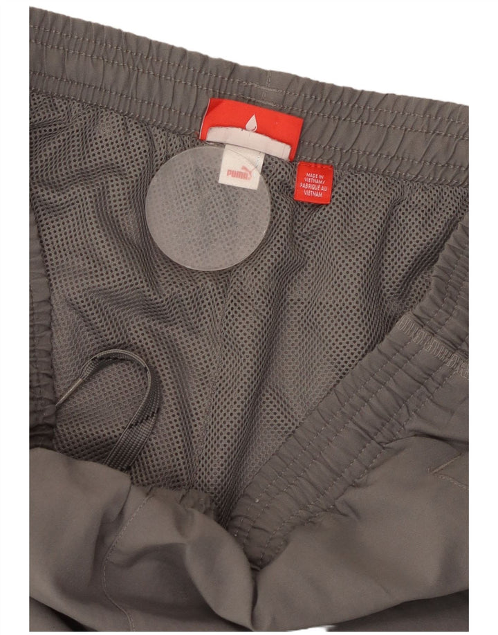 Calça de treino masculina PUMA Graphic Joggers cinza pequeno