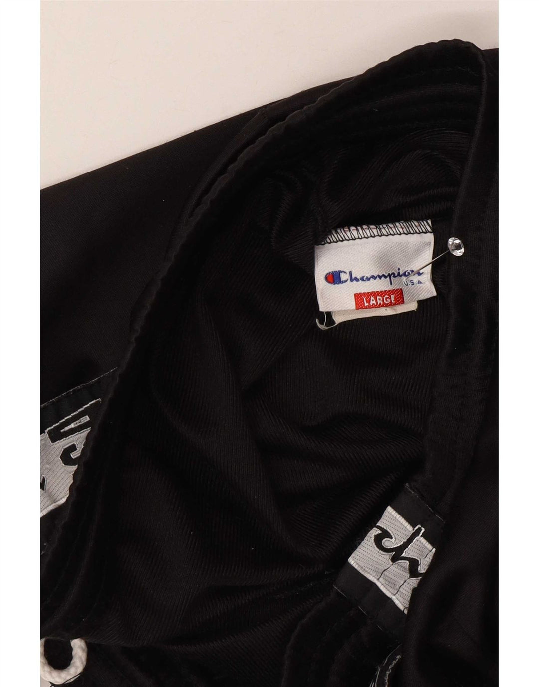 Calça esportiva masculina Champion com estampa gráfica grande em poliéster colorido preto