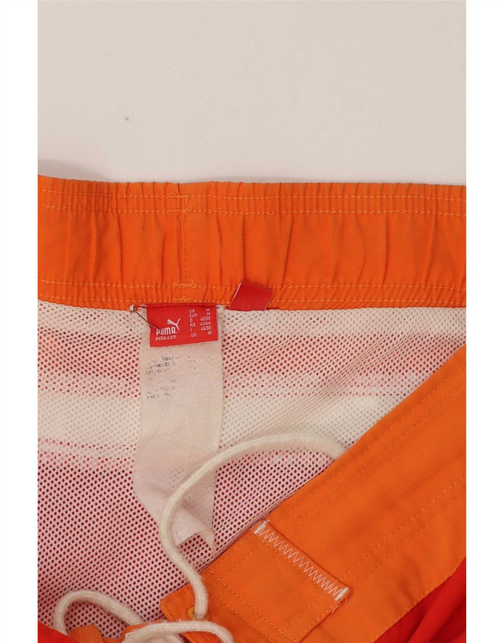 Shorts de natação masculinos Puma Graphic médio vermelho colorblock