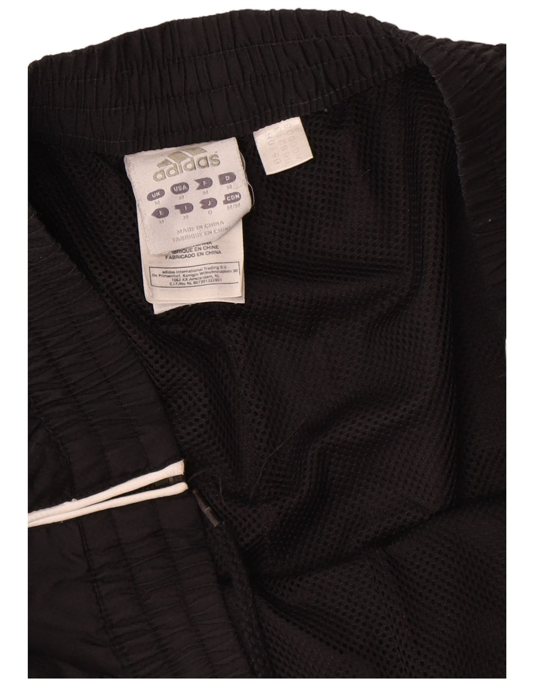 Calça de treino masculina Adidas médio preto colorblock poliéster