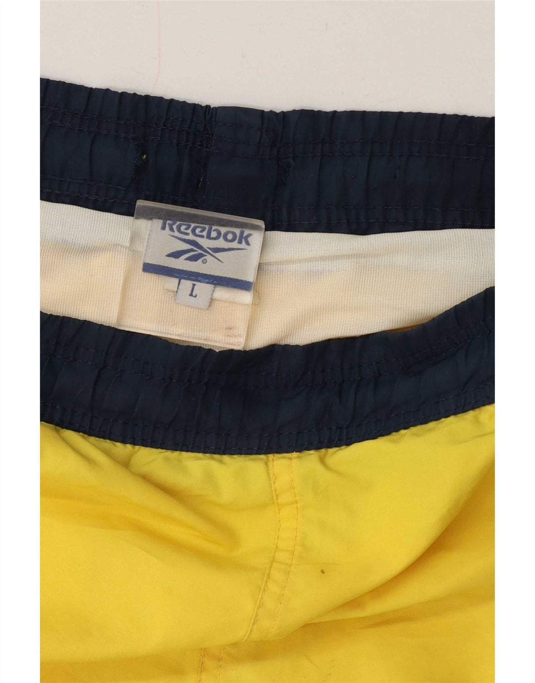 Shorts esportivos masculinos Reebok grande bloco colorido amarelo
