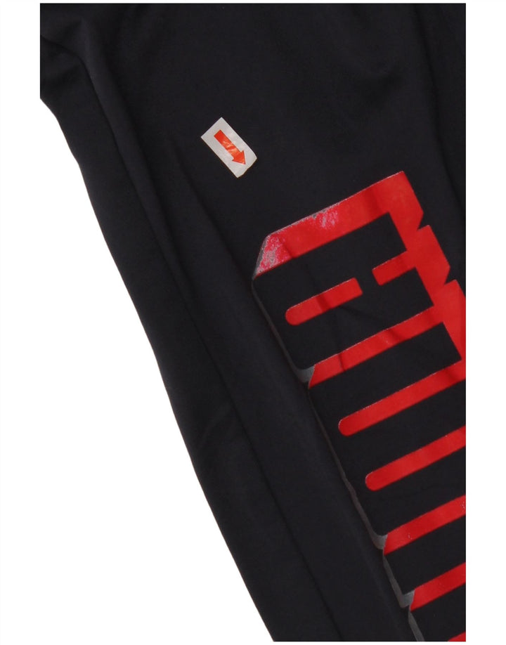 Calça de treino PUMA Boys Graphic Joggers 13-14 anos grande azul marinho