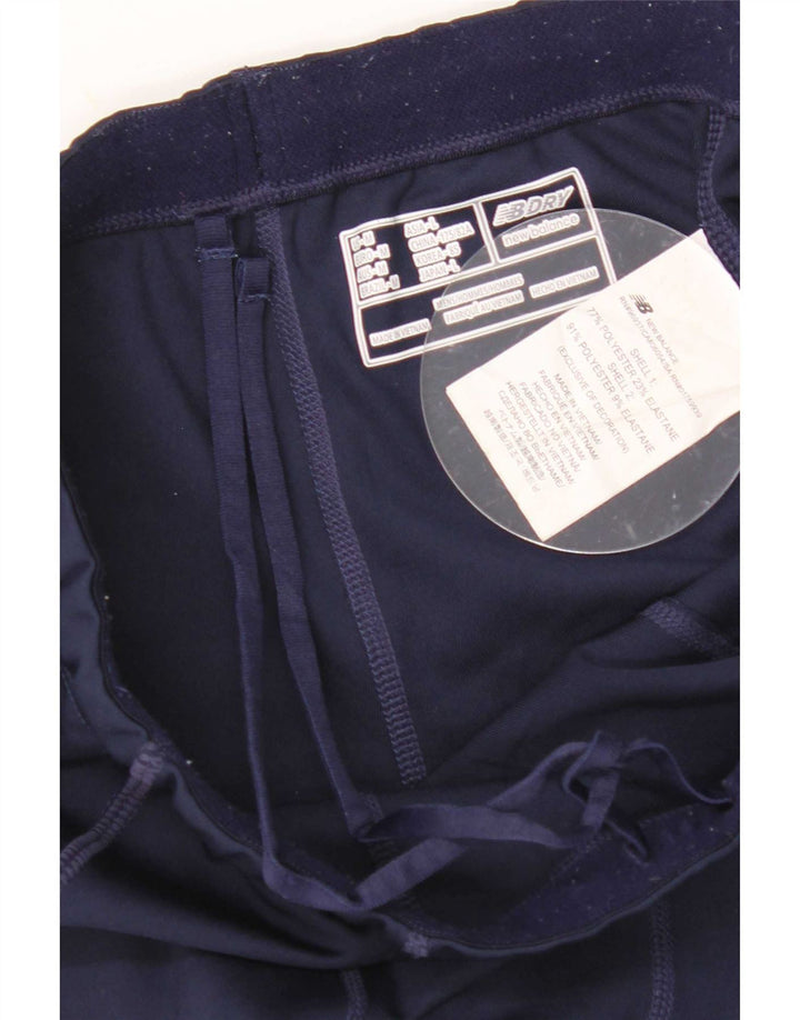 Leggings gráficas femininas New Balance UK 12 poliéster azul marinho médio