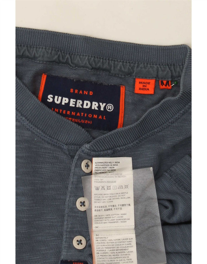 Top masculino Superdry manga comprida algodão manchado azul médio
