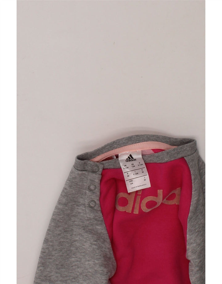 ADIDAS Baby Girls Graphic Sweatshirt Jumper 9-12 Months Pink Colourblock Vintage Adidas and Second-Hand Adidas from Messina Hembry 