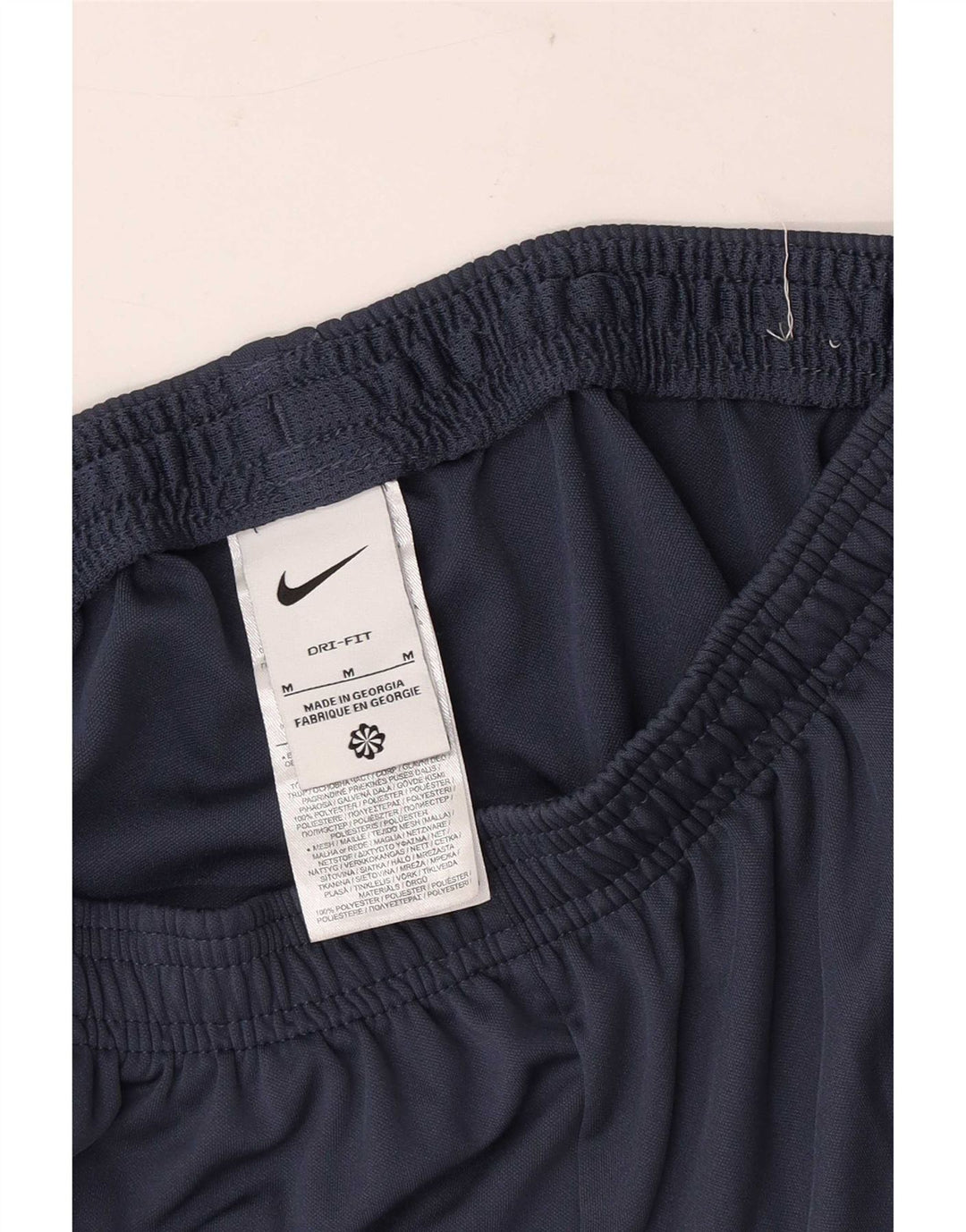 Calça de treino masculina Nike médio azul marinho colorblock poliéster esportivo