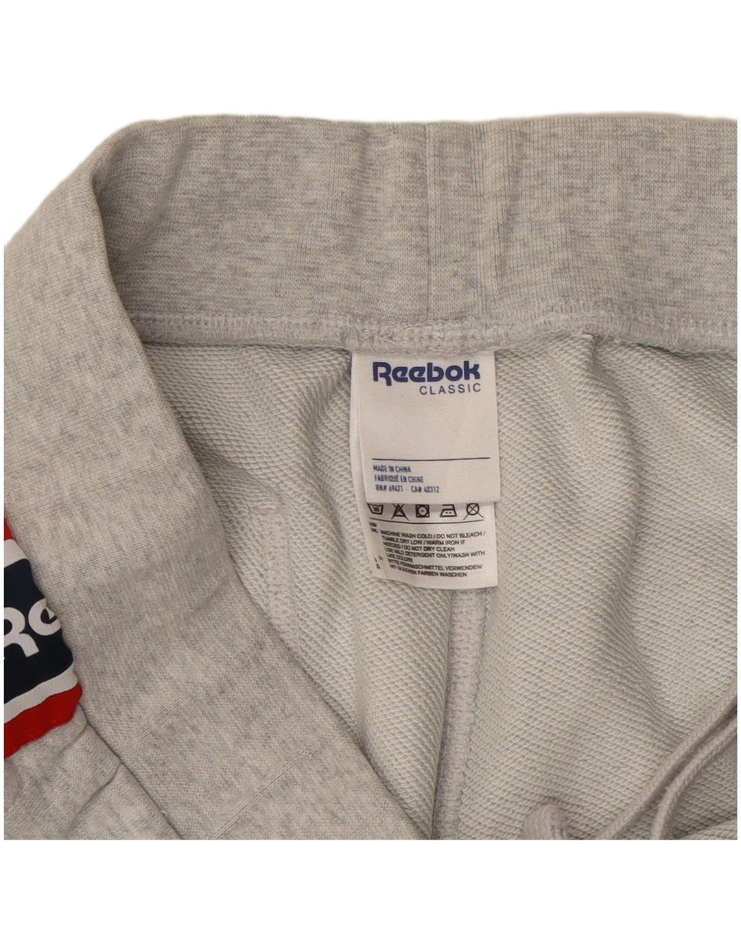 Calça de treino masculina Reebok Graphic Joggers cinza médio colorblock