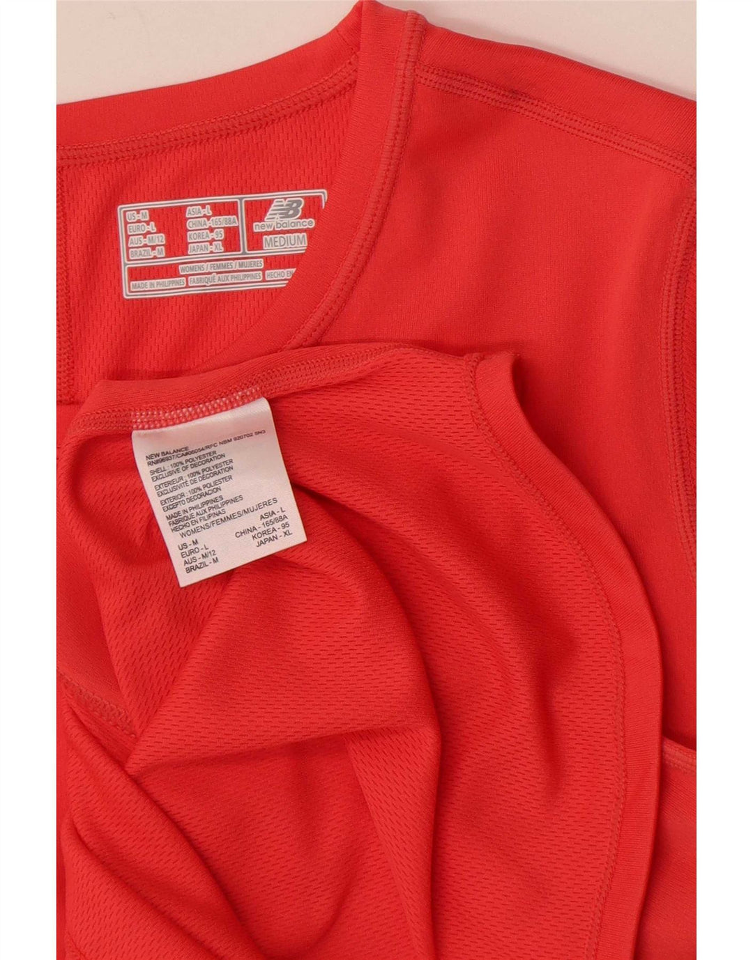 Camiseta feminina New Balance UK 14 grande poliéster vermelho