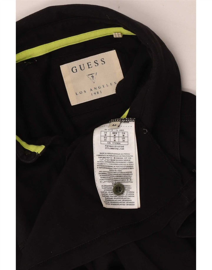 Guess Camisa polo masculina gráfica média de algodão preto
