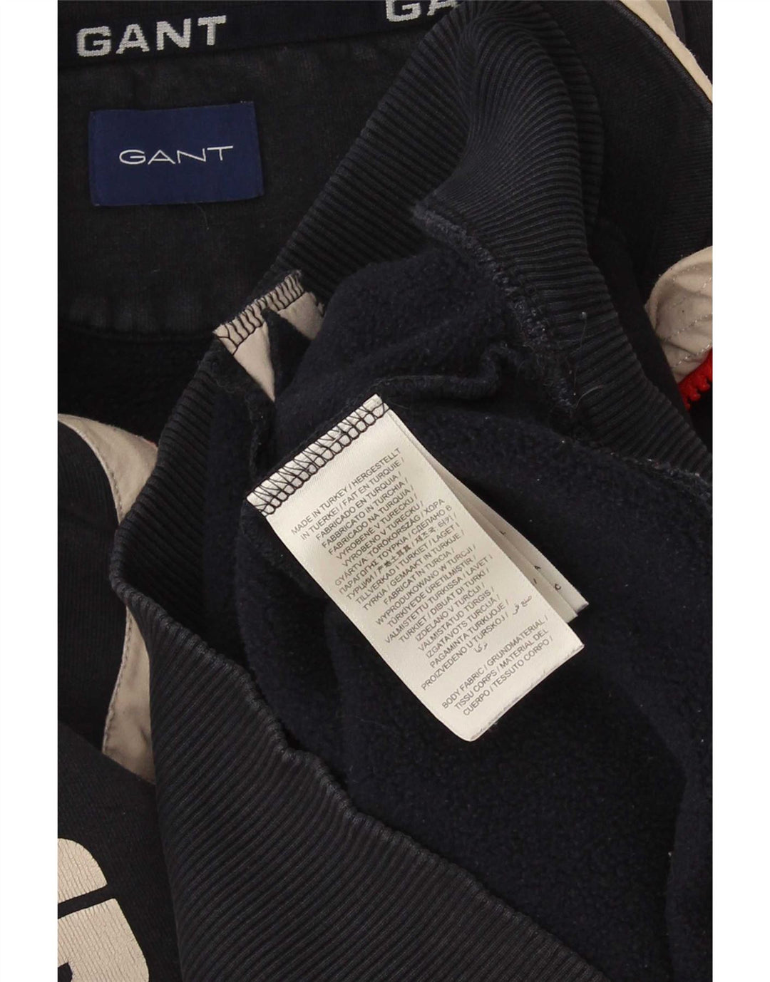 Suéter masculino Gant com gola e zíper gráfico pequeno bloco colorido azul marinho