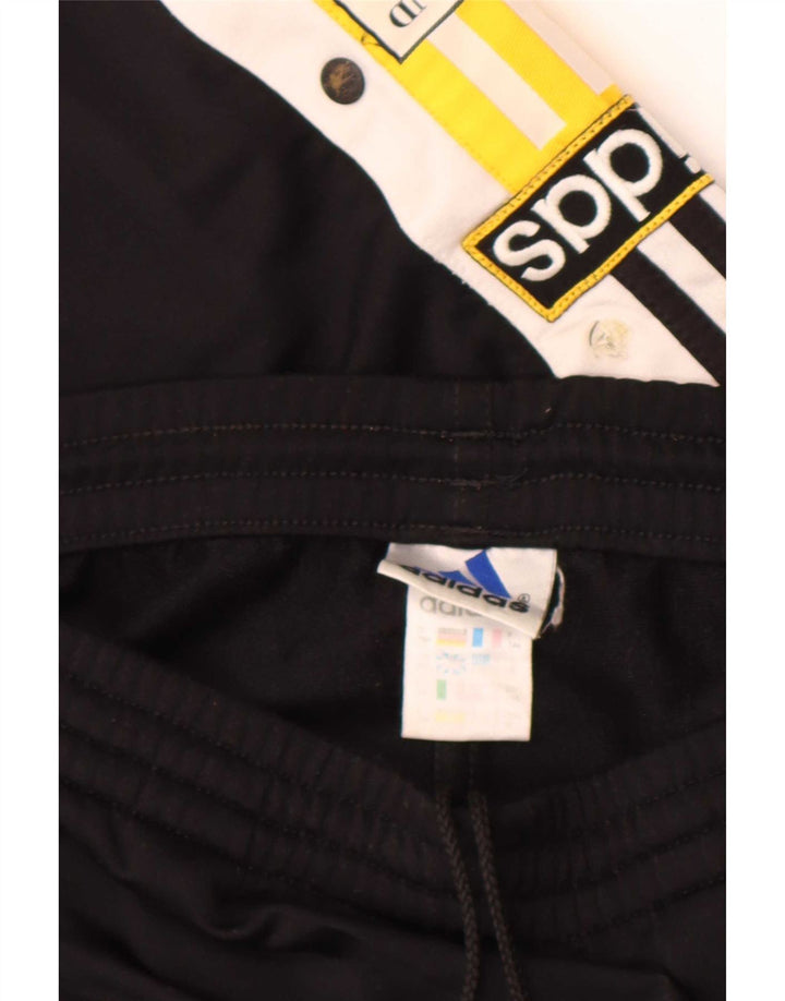 Calça de treino masculina Adidas Graphic, médio preto colorblock poliéster
