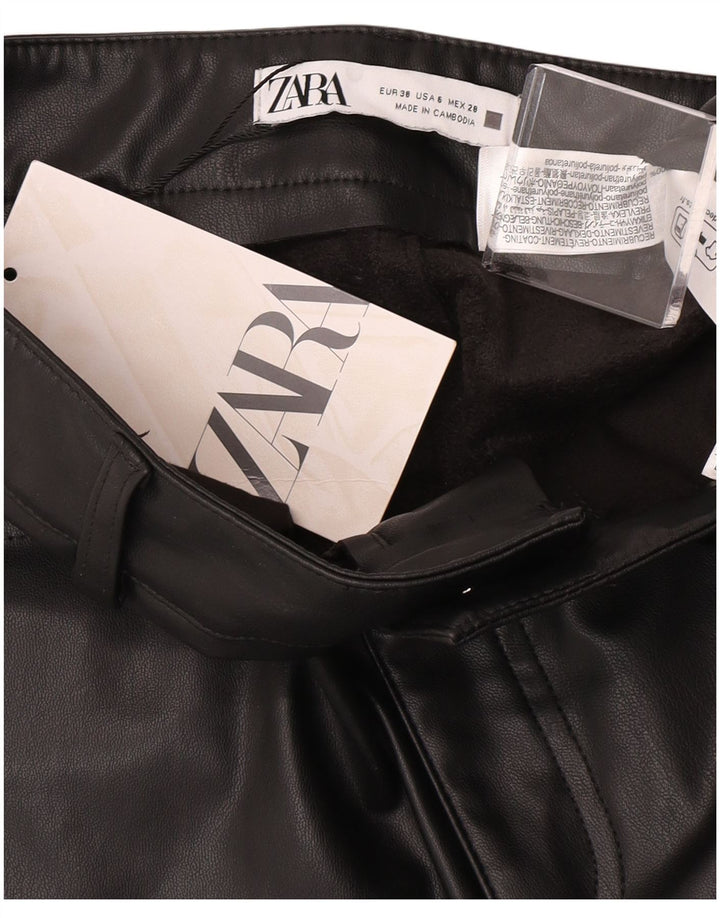 Calça feminina Zara Bootcut de couro sintético UE 38 pequena W28 L26 preta