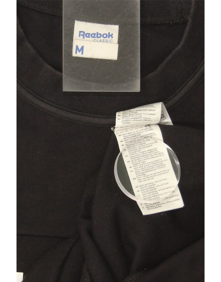 REEBOK Mens Graphic Sweatshirt Jumper Medium Black Cotton Vintage Reebok and Second-Hand Reebok from Messina Hembry 