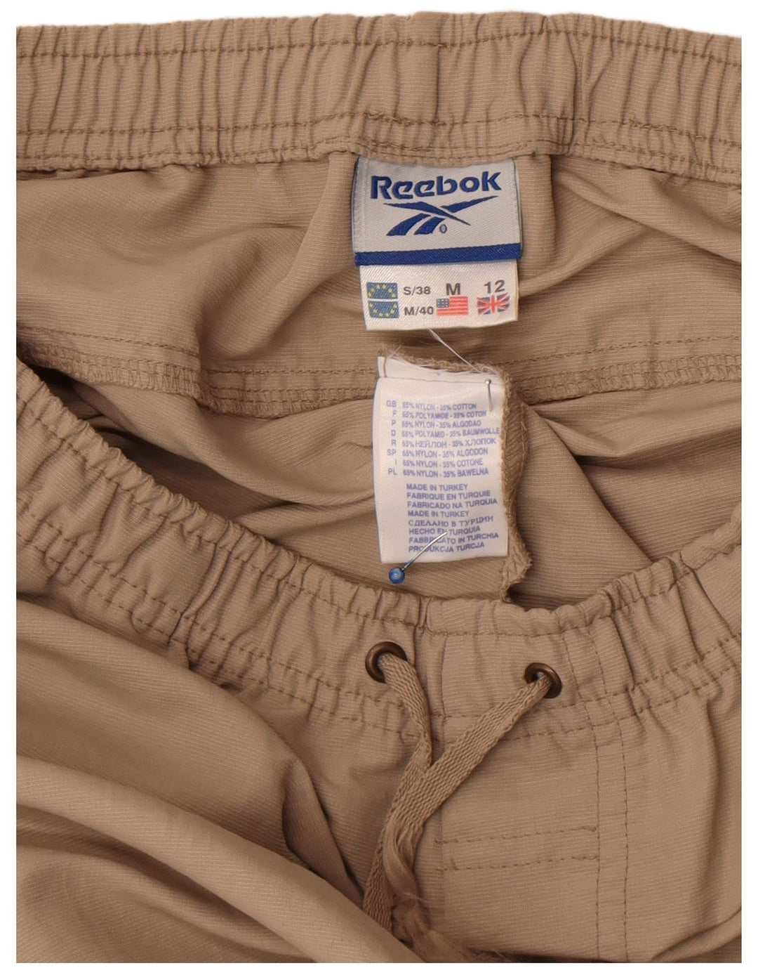 Calça de treino feminina Reebok UK 12 médio bege nylon