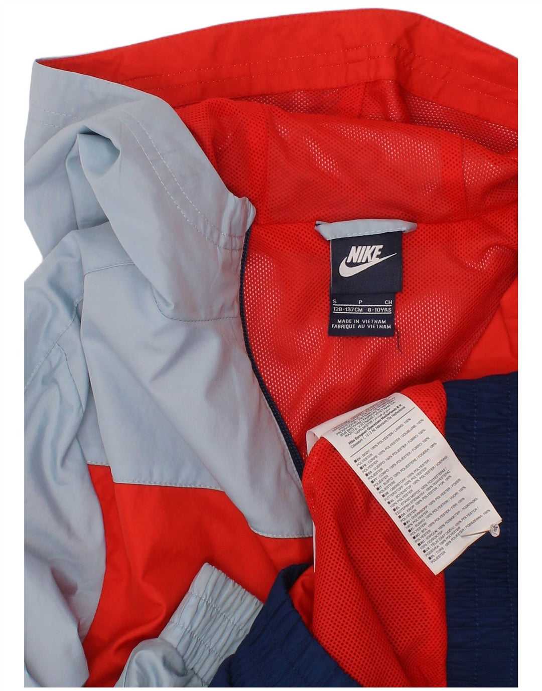 Jaqueta de chuva com capuz Nike Boys 8-9 anos pequena azul marinho Colourblock