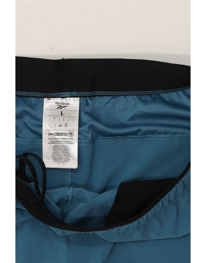 Shorts esportivos masculinos Reebok grande poliéster azul