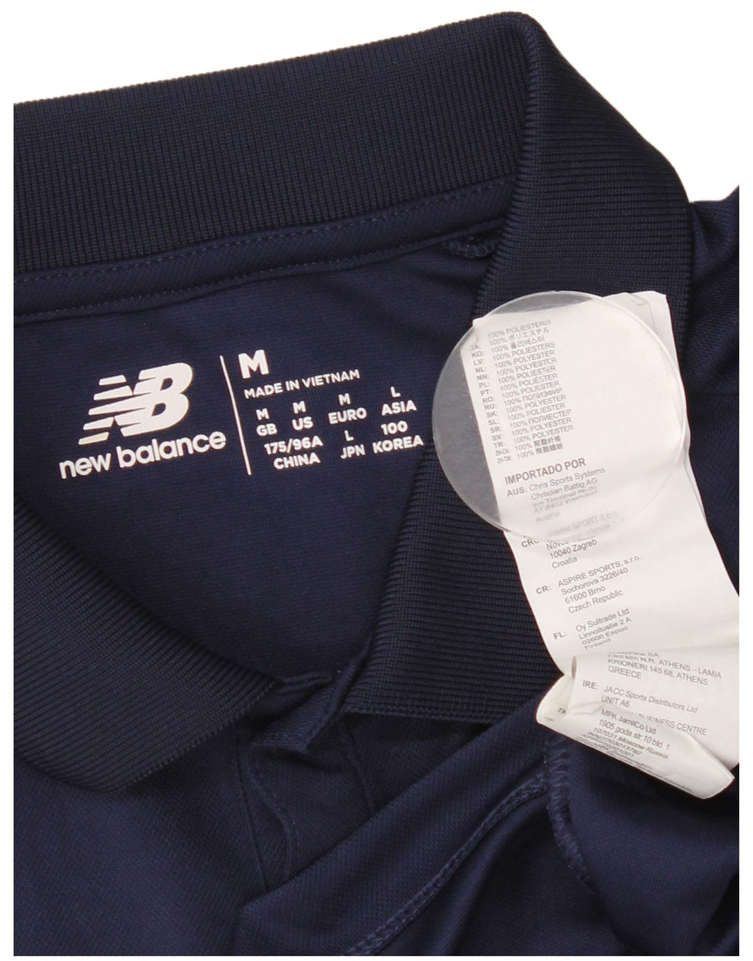 Camisa pólo gráfica masculina New Balance poliéster azul marinho médio