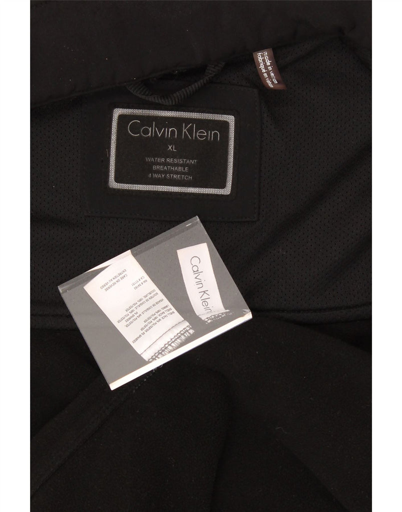 CALVIN KLEIN Mens Graphic Tracksuit Top Jacket XL Black Polyester Vintage Calvin Klein and Second-Hand Calvin Klein from Messina Hembry 