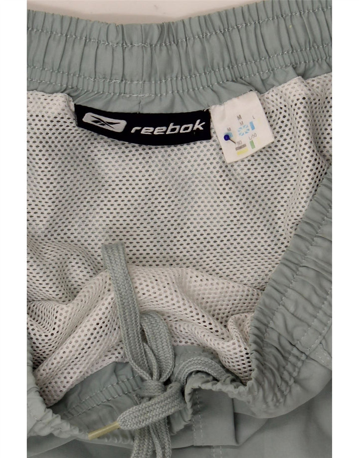 Shorts esportivos masculinos Reebok médio azul poliéster