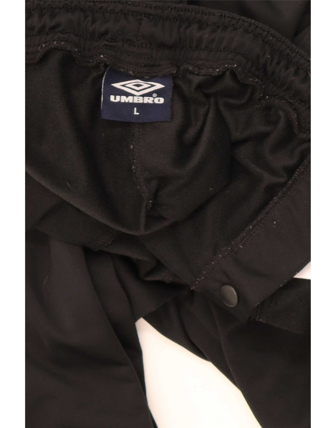 Calça de treino masculina Umbro com estampa gráfica grande em poliéster colorblock preto