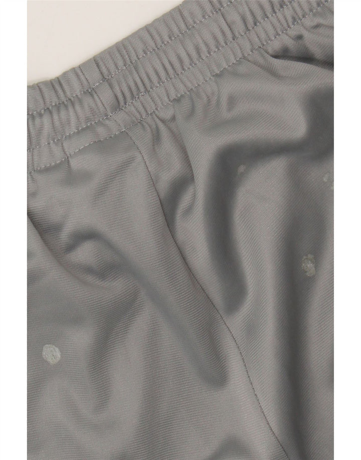 Calça de treino masculina Umbro com estampa gráfica grande cinza colorblock poliéster