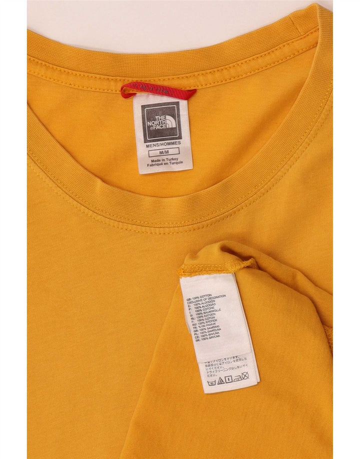 Camiseta gráfica masculina The North Face algodão amarelo médio
