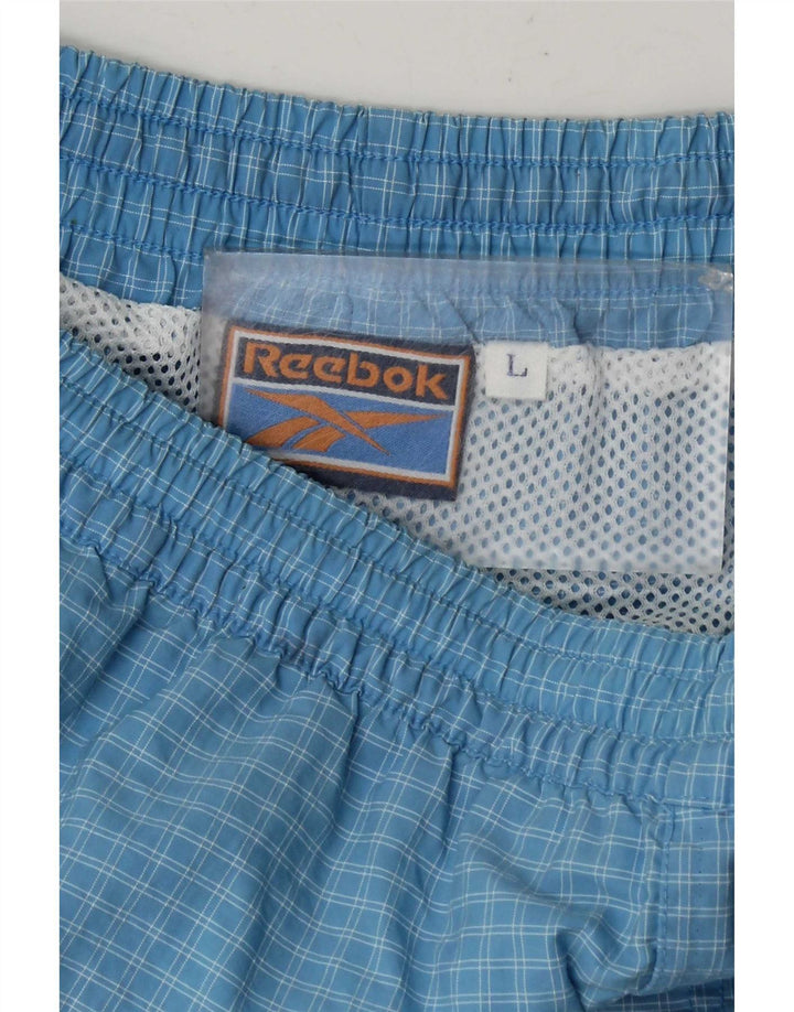 Shorts esportivos masculinos Reebok grande xadrez azul