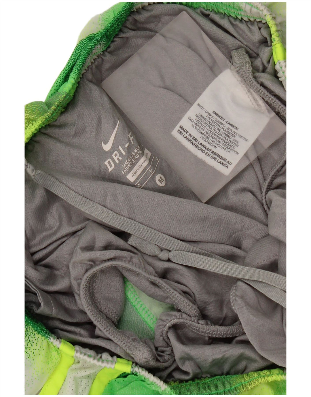 Shorts esportivos femininos Nike Dri Fit UK 12 poliéster geométrico verde médio