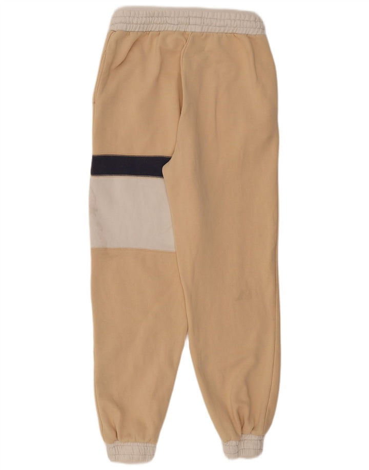 Calça esportiva masculina Roxy com estampa gráfica grande bloco colorido bege