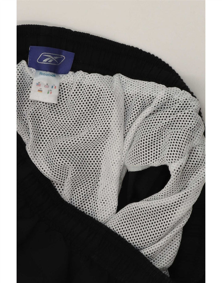 Shorts esportivos masculinos Reebok médio preto poliéster