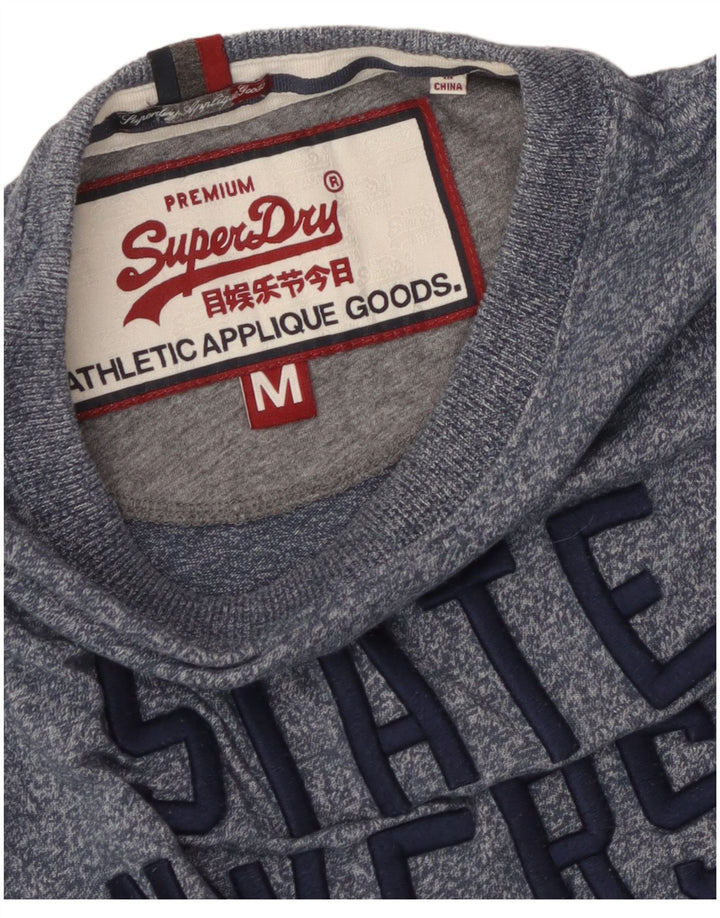 Camiseta gráfica masculina Superdry Top médio azul manchado