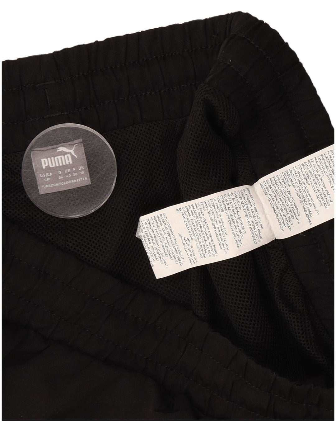 Shorts esportivos femininos Puma UK 10 pequeno poliéster preto