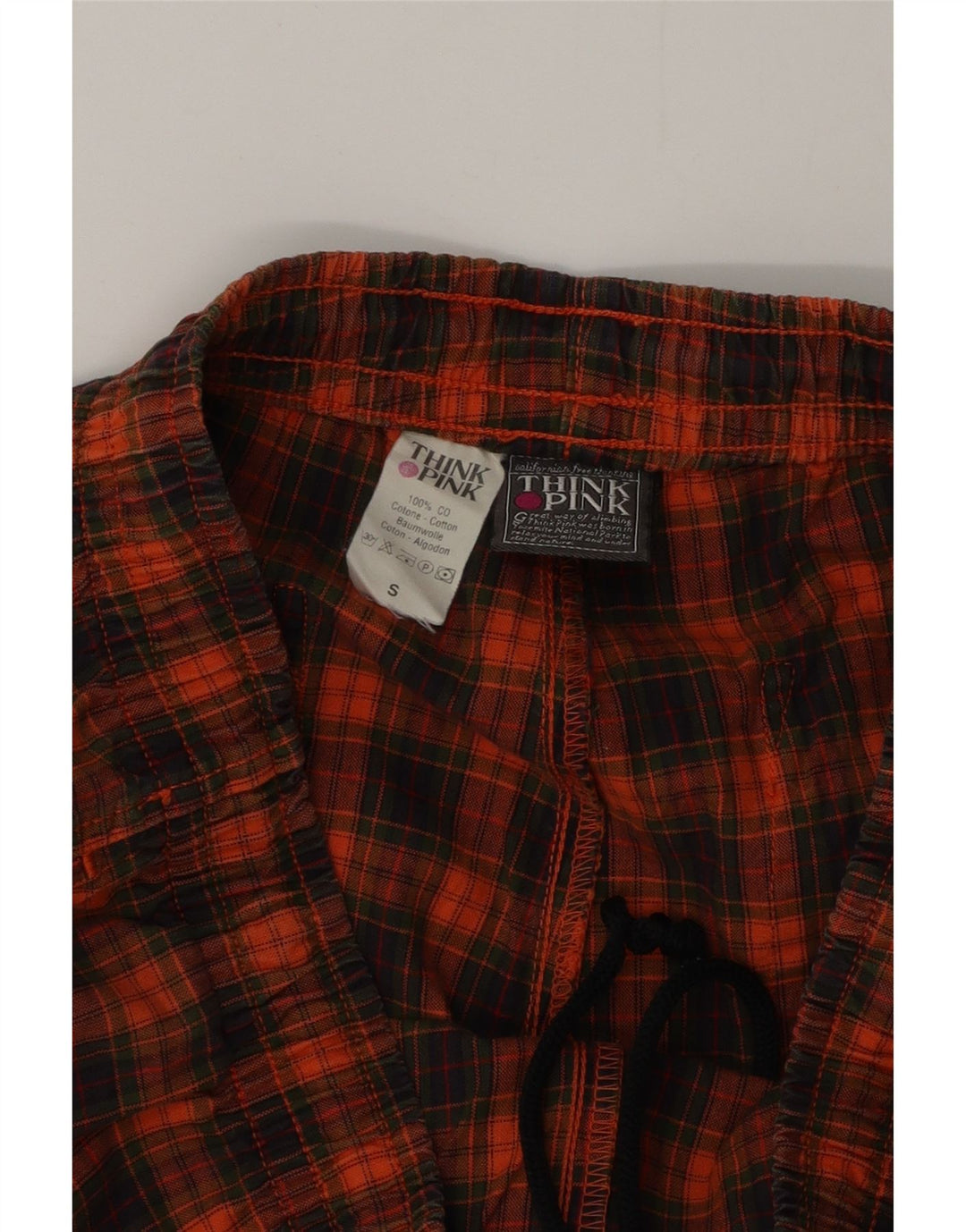 Calça de treino masculina Think Pink com estampa gráfica pequena laranja xadrez de algodão