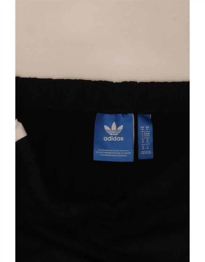 Calça de treino masculina Adidas médio preto colorblock poliéster