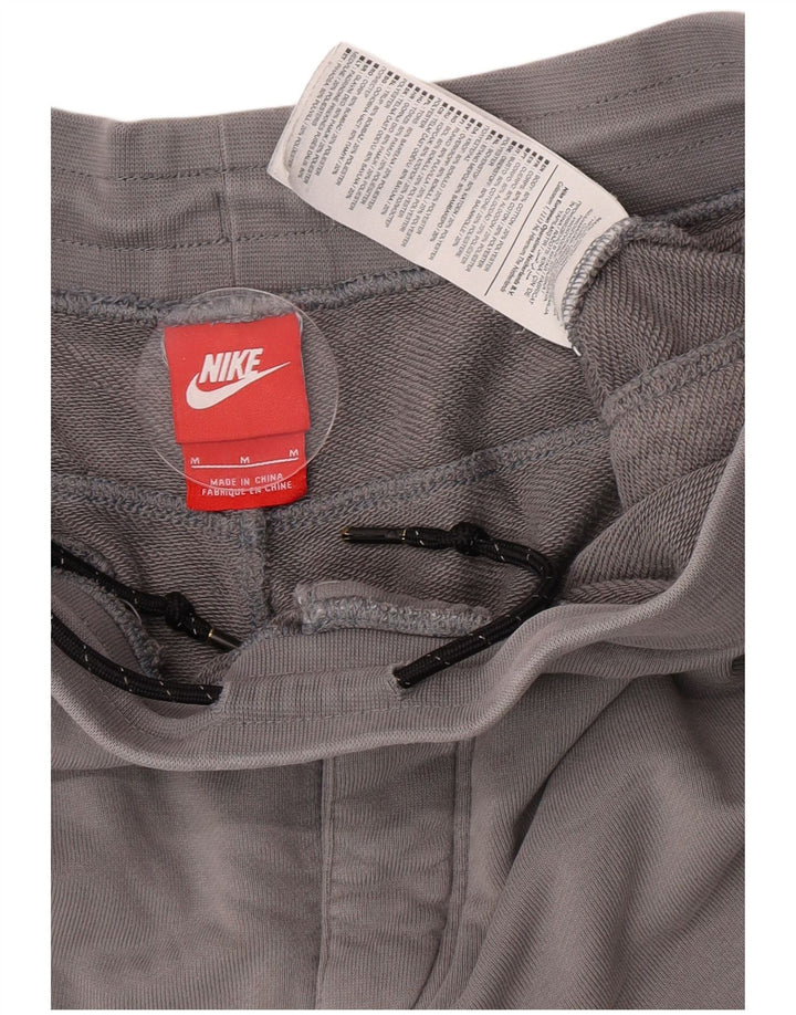 Calça de treino masculina Nike Graphic Joggers cinza médio colorblock