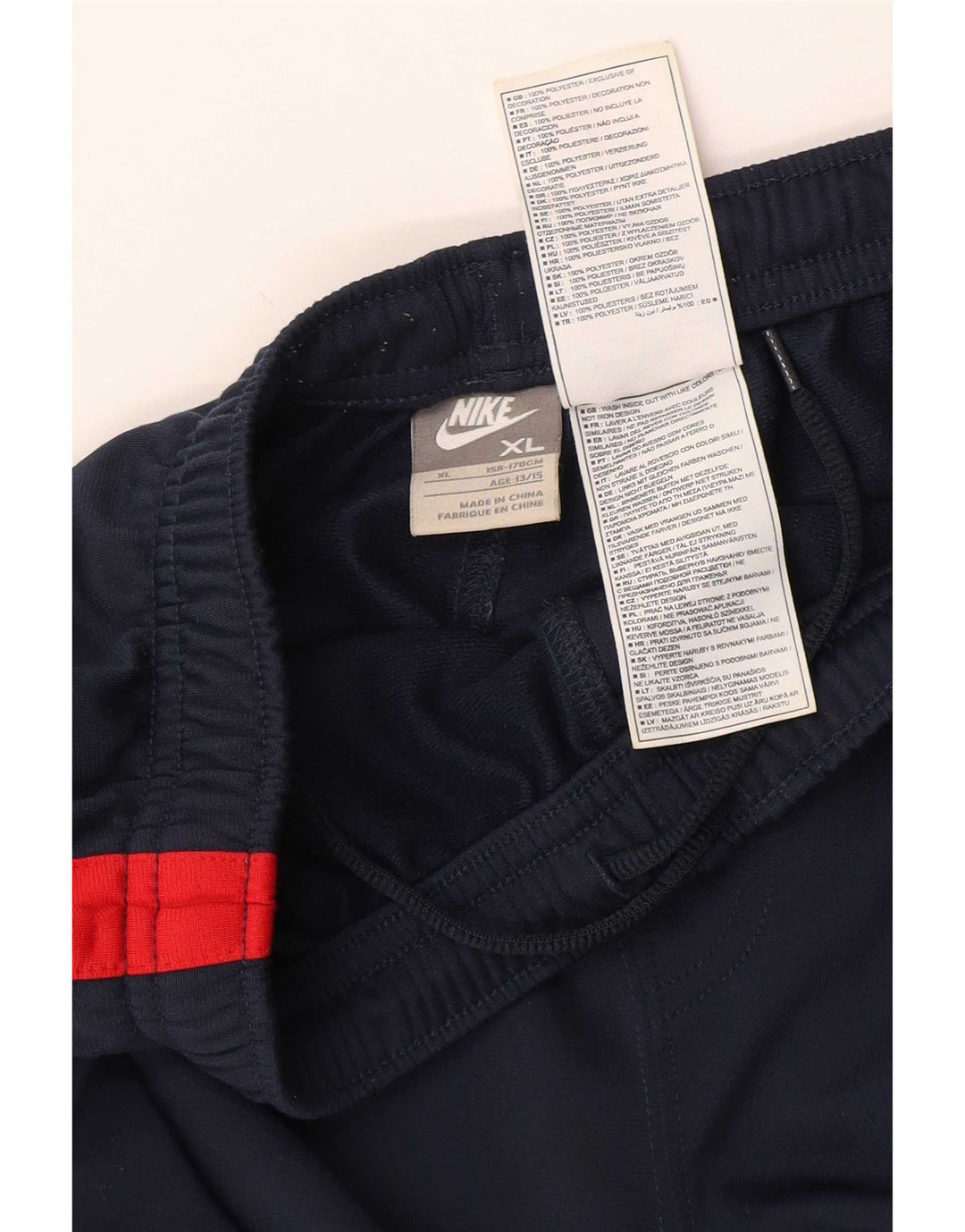 Calça de treino Nike Boys 13-14 anos XL azul marinho colorblock poliéster