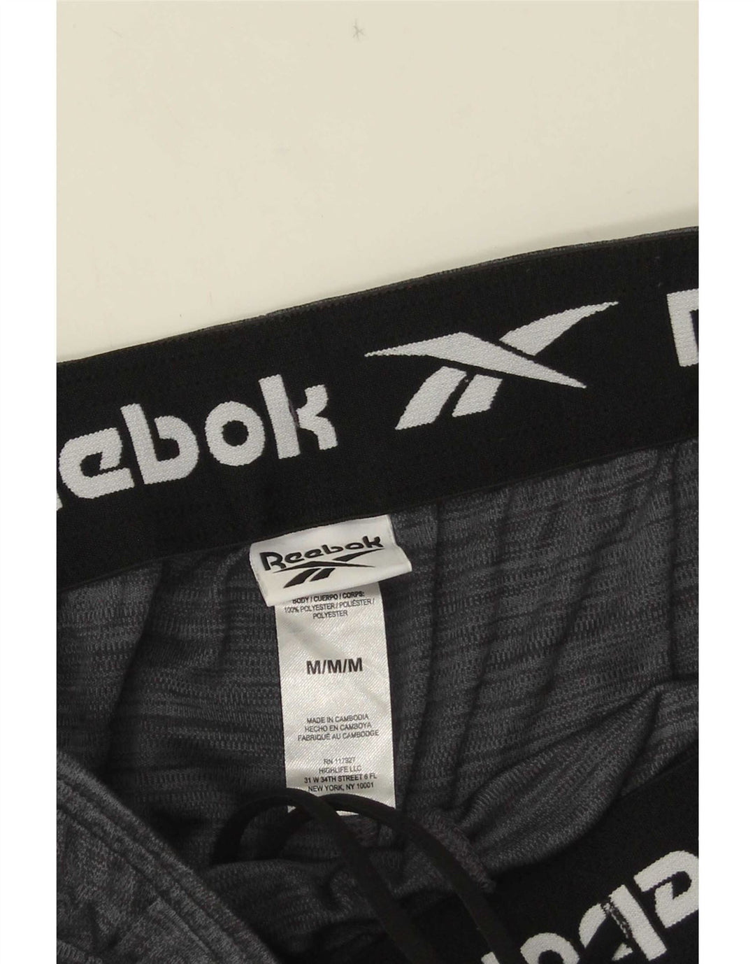 Shorts esportivos masculinos Reebok poliéster cinza médio